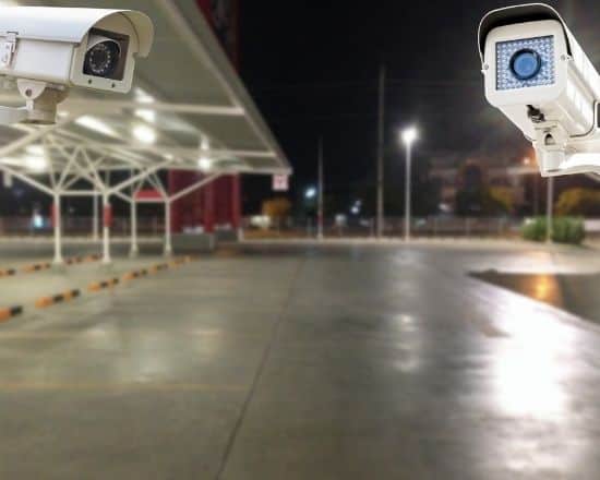Security guard monitoring video screens